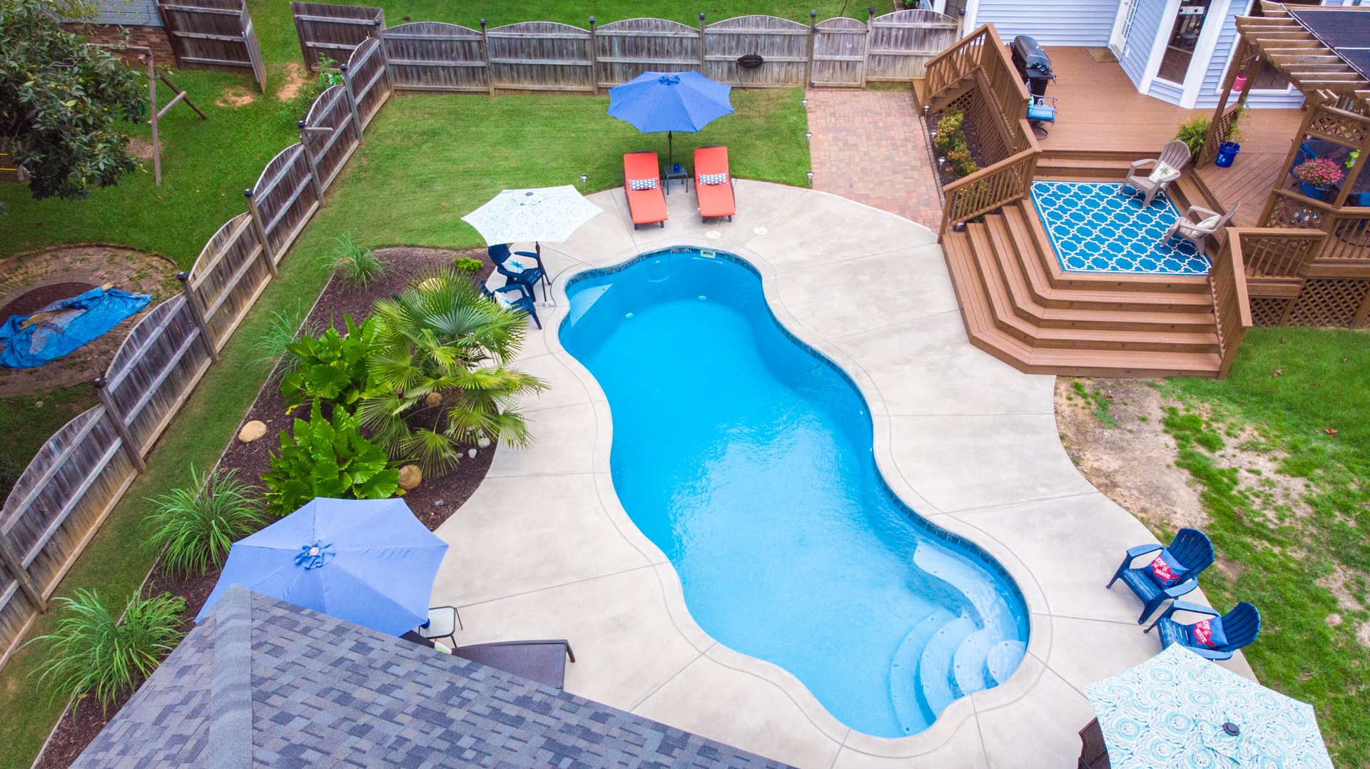 Overhead view of a custom pool installation with landscaping