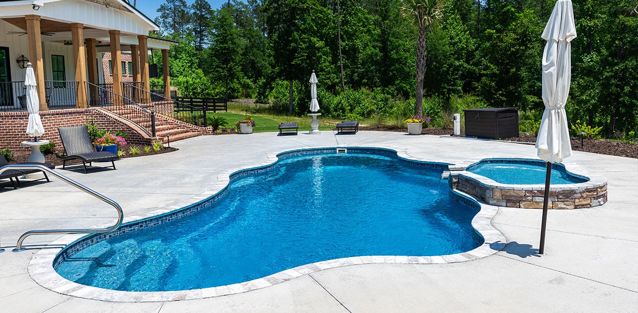 Featured image of the Henderson project showing their Cancun pool with tanning ledge
